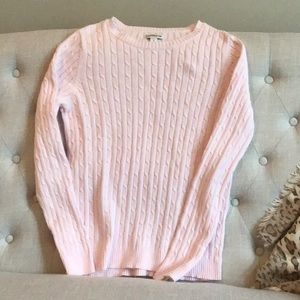 Baby pink long sleeved cable knit sweater.